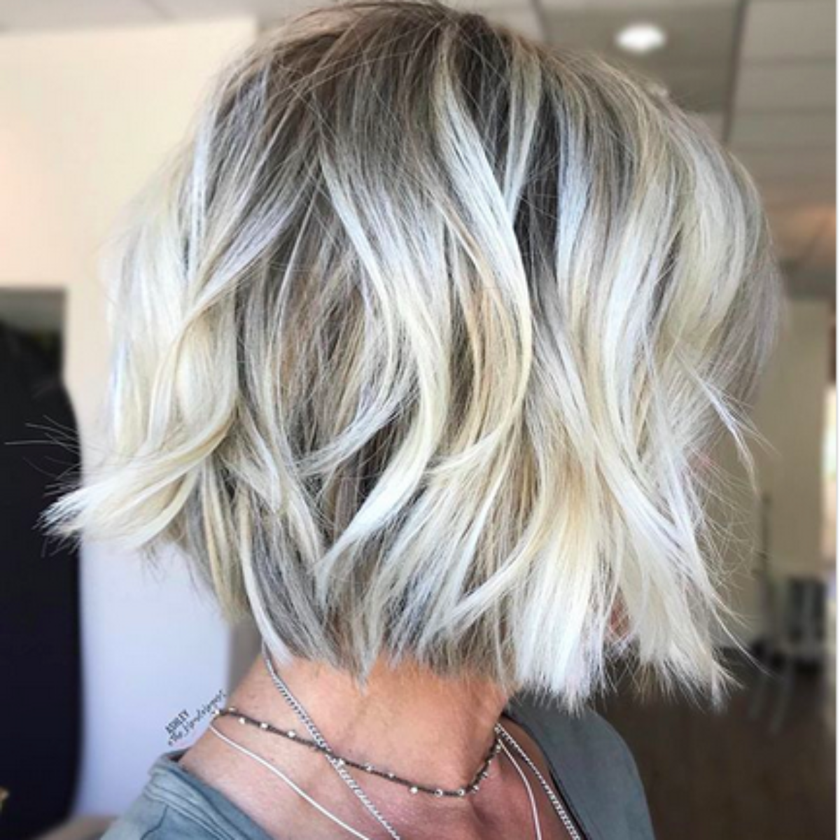 Bright cool blonde hair color on model