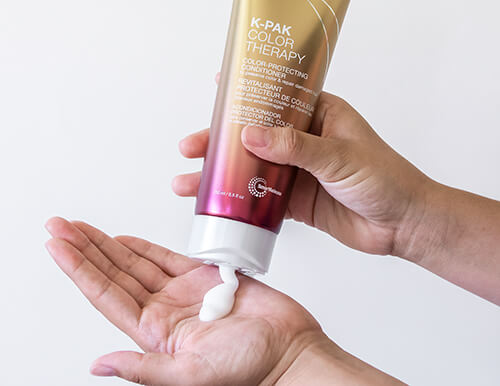 K-PAK Color Therapy Conditioner in hand