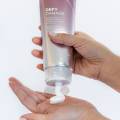 Defy damage conditioner showing product in hand
