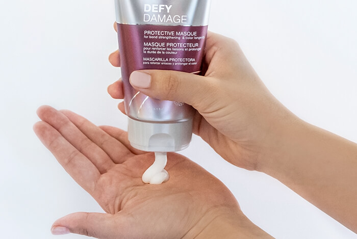 defy-damage-masque-in-hand Defy damage masque showing product in hand
