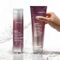 defy damage shampoo and conditioner with water splashing and hand reaching for conditioner