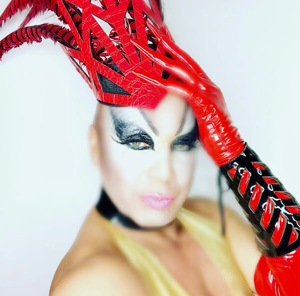 image1 Drag Queen in vibrant red headers and gloves