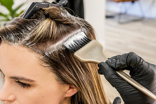 lumi-10-salon-hair model image in salon getting roots touched up